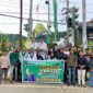 Kader HMI Cabang Jayapura berfoto bersama di belakang spanduk kegiatan berbagi takjil di Kota Jayapura, Papua, Minggu, 15 Maret 2026. Foto: dok. HMI Cabang Jayapura.