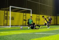 Momen pertandingan SMK Petra melawan SMA Negeri 6 pada laga perdana Kapolda Cup II Minia Soccer di Goldstone Arena Mini Soccer, Timika, Papua Tengah, Selasa (12/5/2026). (Foto: Istimewa/Fernando Rio)
