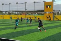 SMK PK Yapis Timika melakoni SMK Harapan dalam babak penyisihan grup terakhir Turnamen Minisoccer Kapolda  Cup II di Goldstone Arena, Minggu (17/5/2026), (Foto: Galeri Papua/Ahmad)