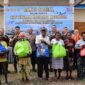 Foto bersama dalam kegiatan bakti sosial yang digelar TNI di Kampung Nawaripi, Distrik Mimika Baru, Kabupaten Mimika, Papua Tengah, Senin (21/9/2026) pagi. (Foto: Pen Lanal Timika)